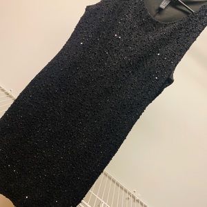 Black sleeveless dress.